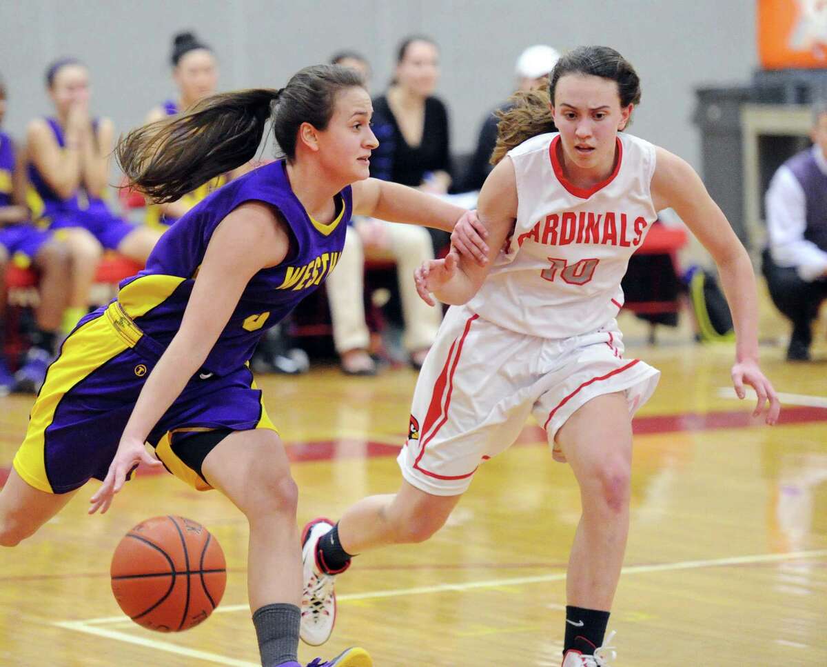 At left, Westhill's Edona Thaqi (#3) dribbles while being defended by Colleen Bennett (#10) of Greenwich during the girls high school basketball game between Greenwich High School and Westhill High School at Greenwich, Conn., Friday night, Jan. 9, 2015.