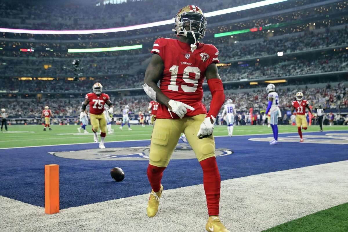 San Francisco 49ers' Deebo Samuel celebrates his 26-yard touchdown run in 3rd quarter against Dallas Cowboys during NFL NFC Wild Card Playoff game at AT&T Stadium in Arlington, Texas on Sunday, January 16, 2022.