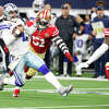 Dak Prescott of the Dallas Cowboys scrambles with the ball on the last play of the game against the San Francisco 49ers.