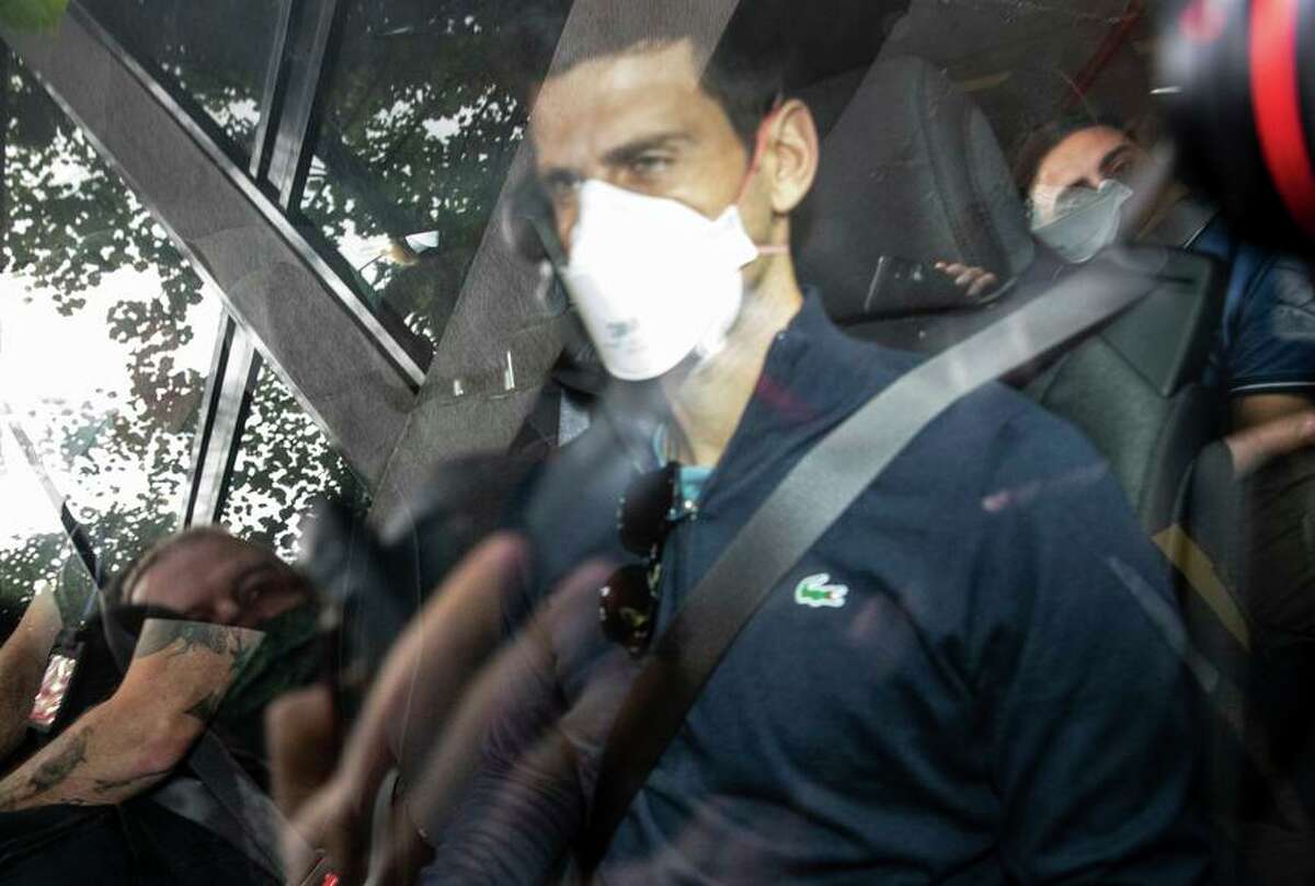 Djokovic leaves the Park Hotel in Melbourne. Court officials ruled that his medical exemption was not valid.