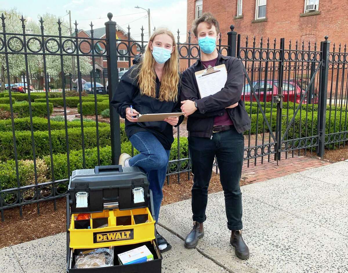 From left are Wesleyan University students and EMTs Livia Cox and Nick Wells, co-founders and co-directors of the Middletown Harm Reduction Initiative. The local nonprofit organization’s mission is to reduce deaths by overdose in Middletown through a syringe exchange program, twice-weekly resource distributions, including Narcan; and community education.