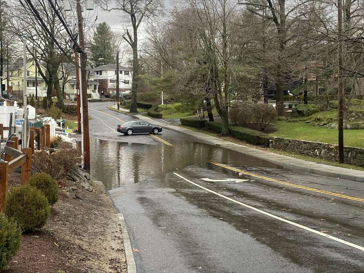 East Weaver Street in Greenwich is closed to traffic due to a large flooded spot Monday, Jan. 17, 2022