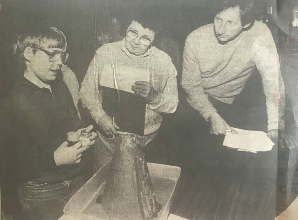 Pine River Elementary fourth grader Russell Hein explains how his volcano works to Sally Roberson and Chip Francke, who were judges at the school's annual science fair. March 1986
