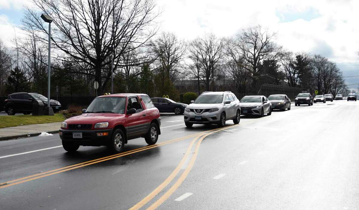 Vehicles participate in the Martin Luther King Day procession from Rogers International School in Stamford, Conn. Monday, Jan. 17, 2022. Presented by the Stamford MLK Committee, dozens of cars were escorted through town in a "procession of lights" from Rogers School to Westover School to honor the life and legacy of the Rev. Dr. Martin Luther King Jr. The motorcade was followed by a virtual forum and panel discussion.