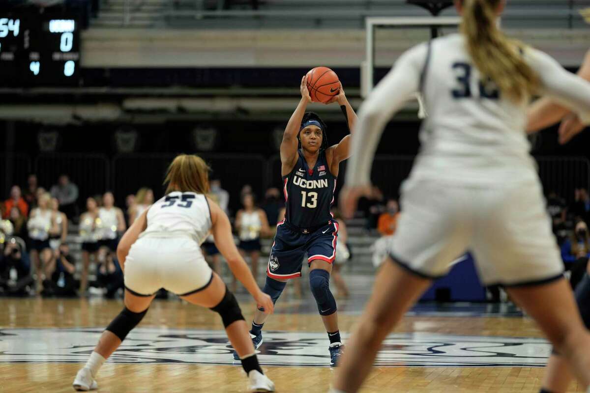 UConn guard Christyn Williams (13) in action during the first half of an NCAA college basketball game between Butler and UConn in Indianapolis, Wednesday, Jan. 12, 2022. (AP Photo/AJ Mast)
