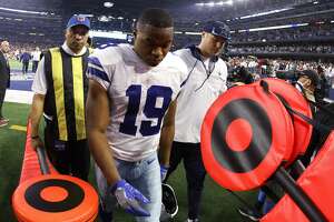 Dallas Cowboys wide receiver Amari Cooper (19) leaves the field following an NFL wild-card playoff football game against the San Francisco 49ers in Arlington, Texas, Sunday, Jan. 16, 2022. The 49ers won 23-17. (AP Photo/Ron Jenkins)