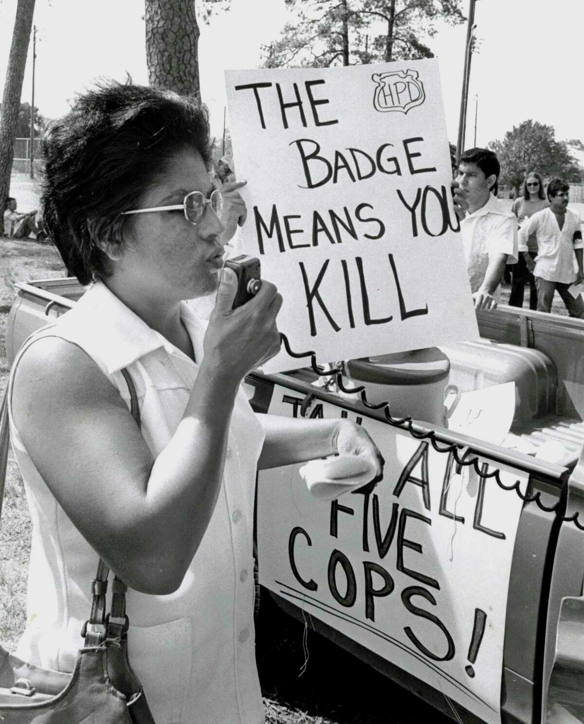 Margarita Torres, mother of Joe Campos Torres (killed by police) speaks to marchers in Moody Park before march Oct. 8, 1977.