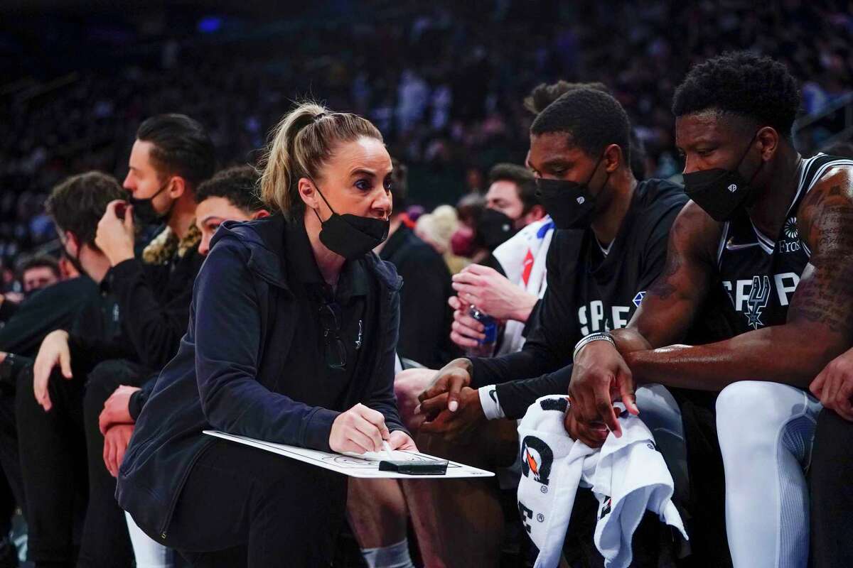 San Antonio Spurs assistant coach Becky Hammon, left, talks to players during the first half of an NBA basketball game against the New York Knicks, Monday, Jan. 10, 2022, in New York.
