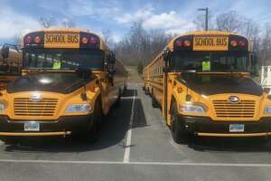 File photo — School buses at the Monroe, Conn. bus depot
