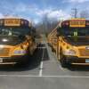 File photo — School buses at the Monroe, Conn. bus depot