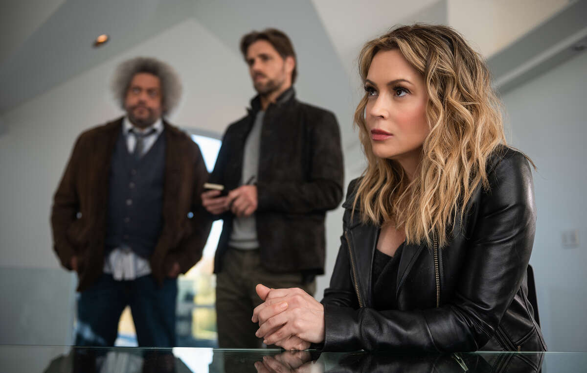 Alyssa Milano, right, is a mystery novelist who receives an urgent message from her estranged sister, Kathleen, who's living next door to a gorgeous homicide detective played by Sam Page in Netflix's "Brazen." 