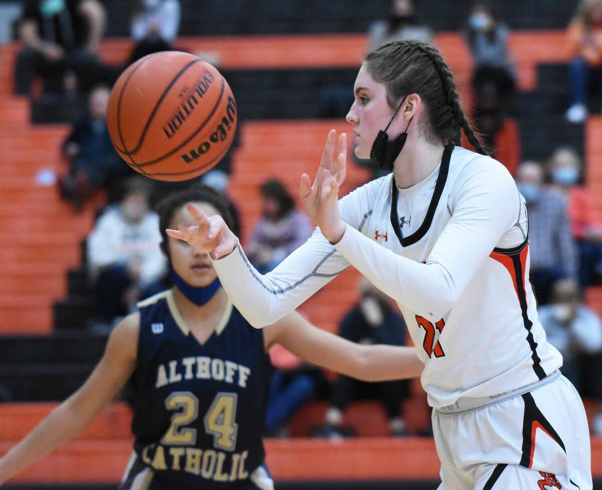 Edwardsville's Elle Evans fires off a pass to a teammate during the fourth quarter against Althoff on Monday inside Lucco-Jackson Gymnasium in Edwardsville.