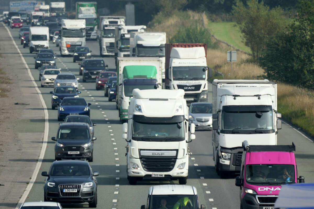 FILE — Trucks and cars make their way along the busy M6 motorway on September 06, 2021 in Warrington, England. (Photo by Christopher Furlong/Getty Images)