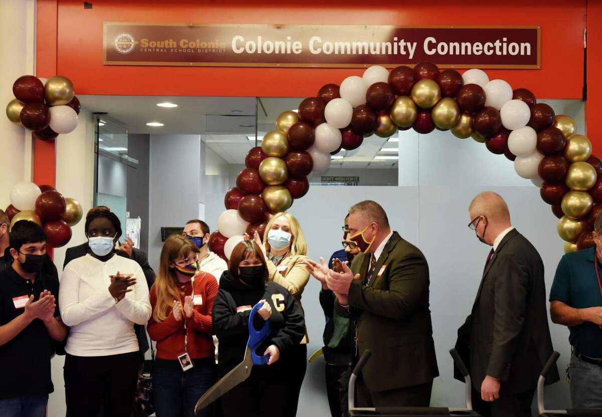 A ribbon is cut to officially open the Colonie Community Connection work program on Tuesday, Jan. 18, 2022, at Colonie Center in Colonie, N.Y. The work program provides students with opportunities for career exploration through partnerships with Boscov's, L.L. Bean, Christmas Tree Shops, Sports Zone and PCX Apparel.