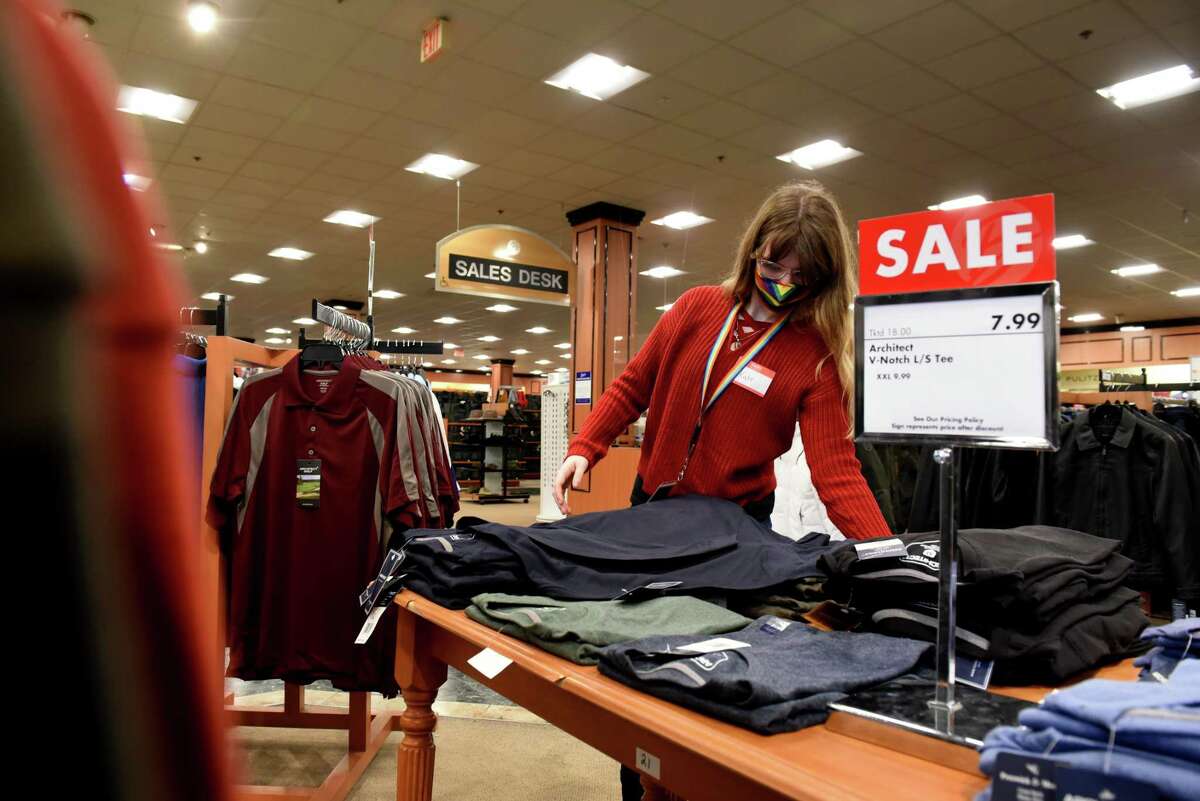 Kate, who is a participant in the Colonie Community Connection work program, folds cloths at Boscov's where she is interning through the program on Tuesday, Jan. 18, 2022, at Colonie Center in Colonie, N.Y. The work program provides students with opportunities for career exploration through partnerships with Boscov's, L.L. Bean, Christmas Tree Shops, Sports Zone and PCX Apparel.