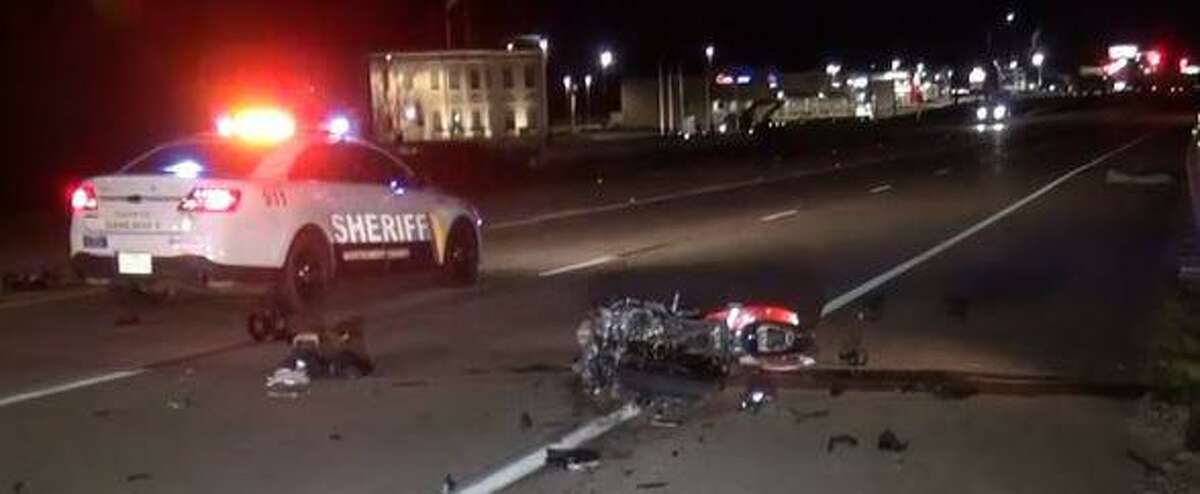 A Suzuki motorcycle is seen Monday night near a parked Montgomery County Sheriff's patrol car in the city of Montgomery following a crash between the biker and a Jeep.