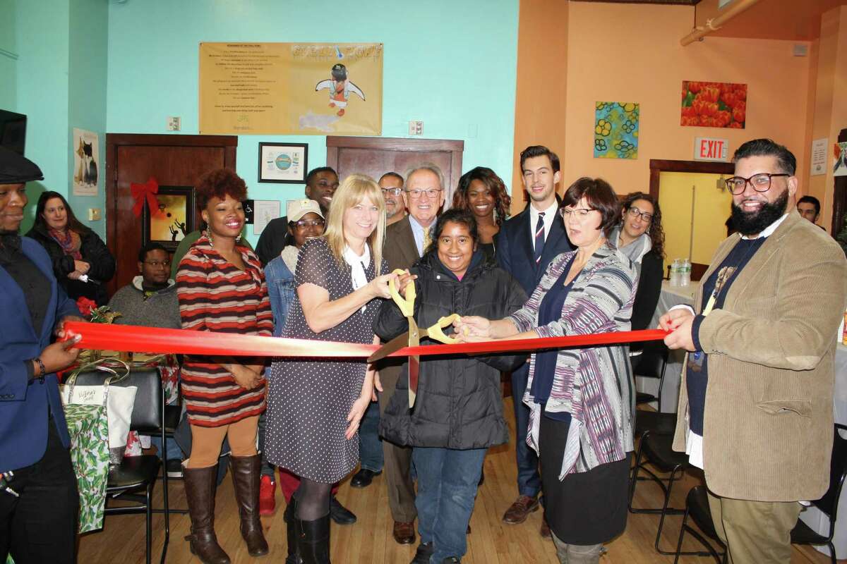 Heather LaTorra president and CEO of the social service agency Marrakech, in the center, cutting the ribbon, in a file photo.