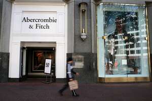 A pedestrian walks by an Abercrombie &amp; Fitch store in San Francisco on Aug. 26, 2015.