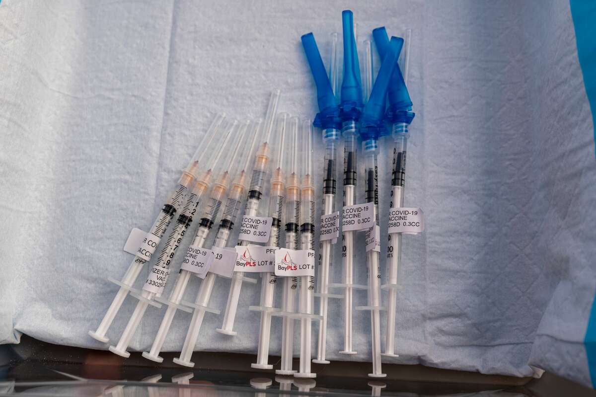 Pfizer-BioNTech COVID-19 vaccine syringes at a COVID-19 vaccination site in San Francisco on Jan. 10, 2022.