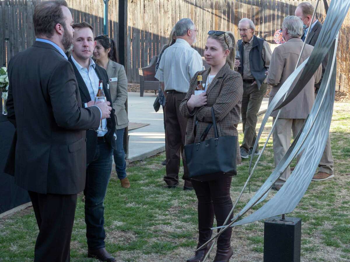 Midlanders come out to celebrate the 20th anniversary of Danny Holeva leading the Arts Council of Midland 01/18/2022 with a reception and gathering the F.M.H. Foundation Sculpture Garden behind the Arts Council main building off Illinois Ave. Tim Fischer/Reporter-Telegram