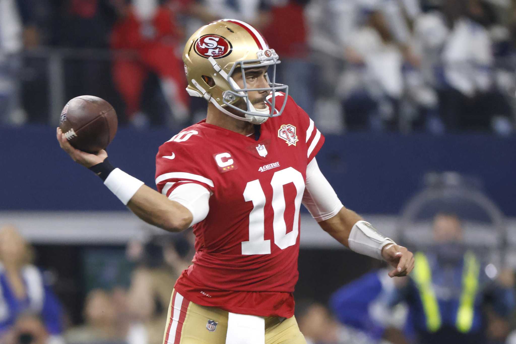 San Francisco 49ers quarterback Jimmy Garoppolo (10) is seen on the  sidelines during a wild card NFL football game against the Dallas Cowboys,  Sunday, Jan. 16, 2022, in Arlington, Texas. San Francisco