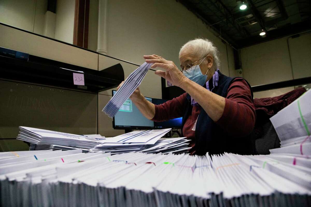 Harris County clerk Judith Rubio, sorts early voting by mail ballots at the Harris County elections headquarters on Friday, Sept. 25, 2020, in Houston.