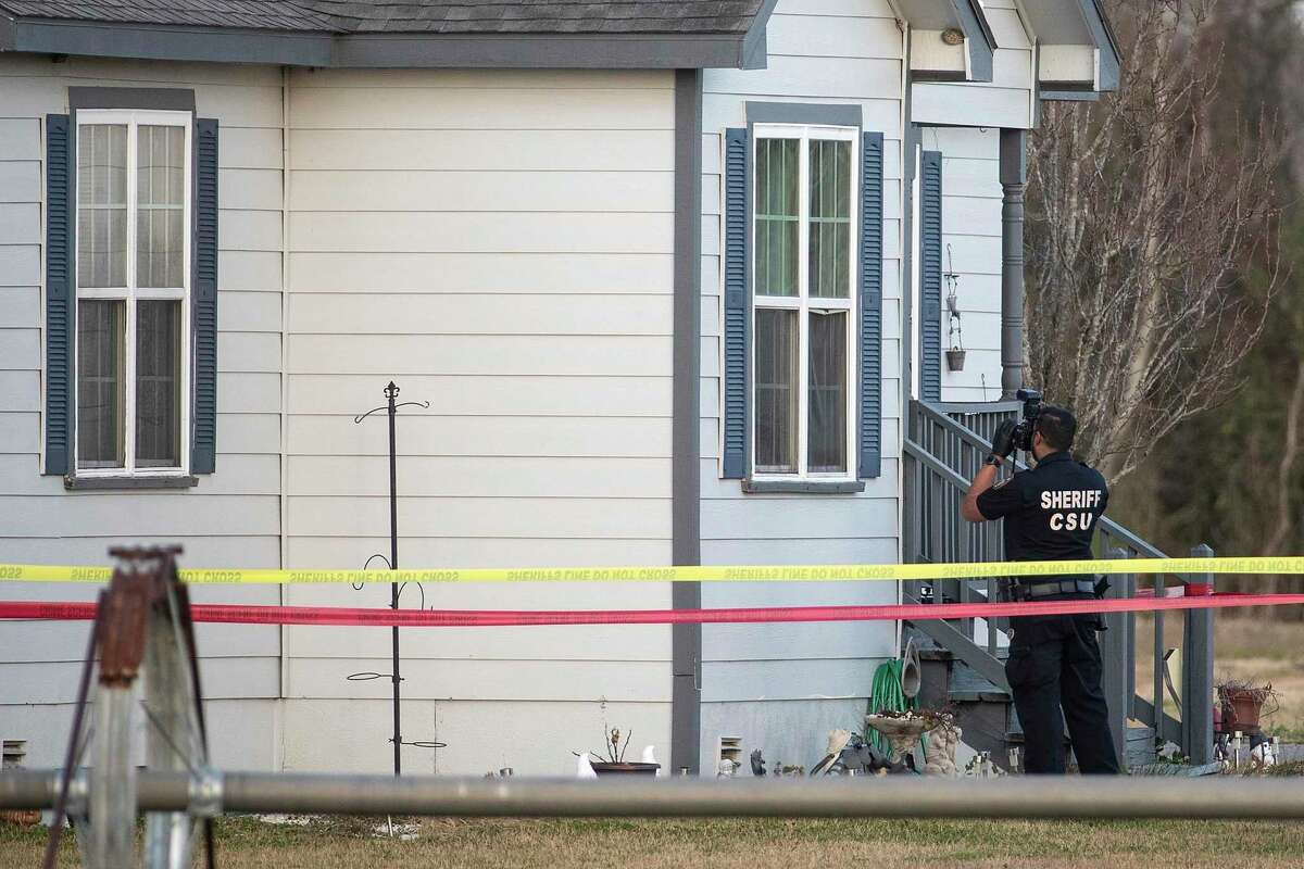 A crime scene investigator works the scene where the bodies of three teenagers were found dead inside of a home Tuesday, Jan. 18, 2022 in Crosby. Sherff Ed Gonzalez said that there were two female and one male victim in an apparent murder, suicide.
