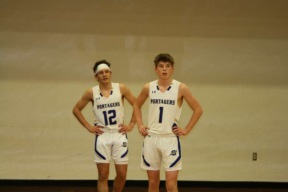 Mason Sinke and Caden Bradford wait for Mesick to bring the ball up the floor.