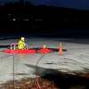 Firefighters train on cold-water rescues at the Higganum Reservoir in Haddam, Conn., on Monday, Jan. 17, 2022.