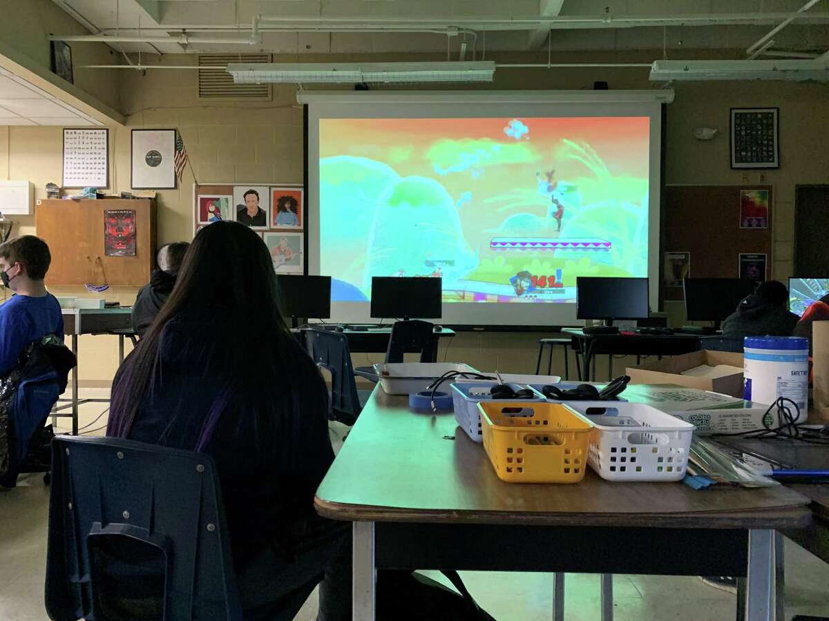 Super Smash Bros. Ultimate fills the projector during the Hall High School esports team practice.