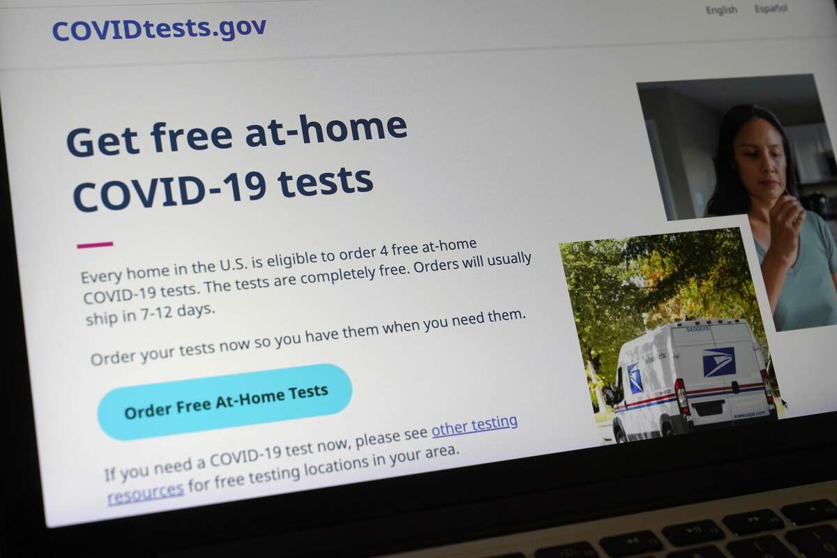 A United States government website is displayed on a computer, Wednesday, Jan. 19, that features a page where people can order free, at-home COVID-19 tests. The website, COVIDTests.gov, allows people to order four at-home tests per residence and have them delivered by mail. (AP Photo/Steven Senne)