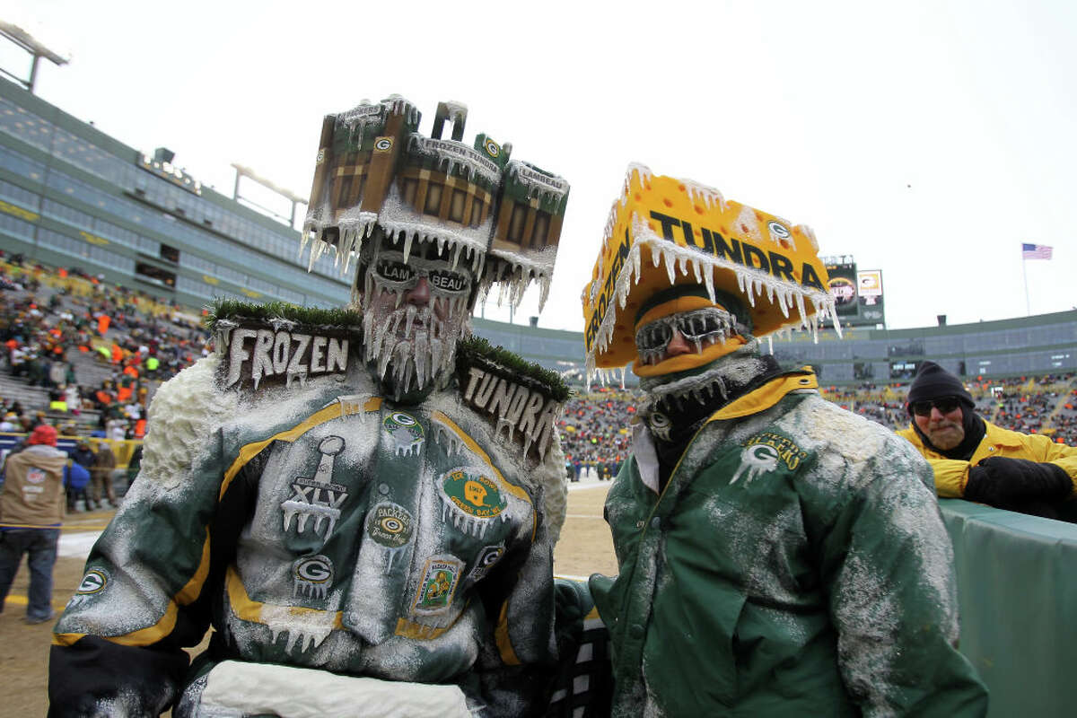 Green Bay Packers fans pose prior to the NFC wild card playoff game between the San Francisco 49ers and the Green Bay Packers at Lambeau Field on Jan. 5, 2014, in Green Bay, Wis.
