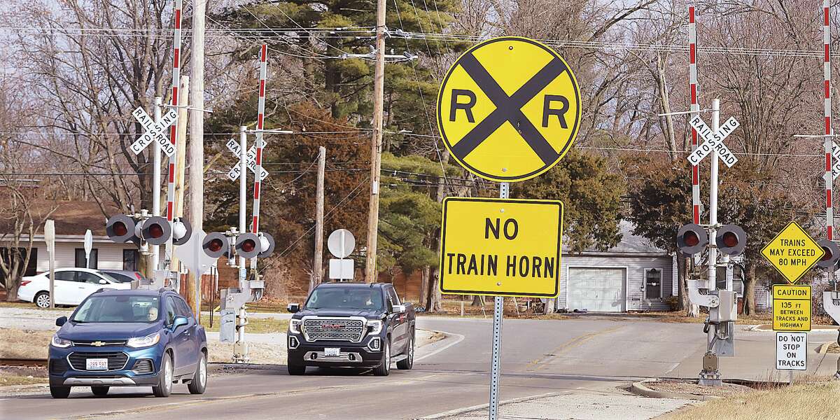 John Badman|The Telegraph A sign warns of the new quiet zone Wednesday at the Alby Street railroad crossing near Humbert Road. Godfrey recently applied for "quiet zones" to be implemented at the Alby Street and Bethany Lane crossings. At those intersections, trains will not sound their horns as they do other places.