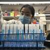 Annabelle Pan, a research scientist in Jordan Peccia’s lab at Yale University, examines sludge samples.