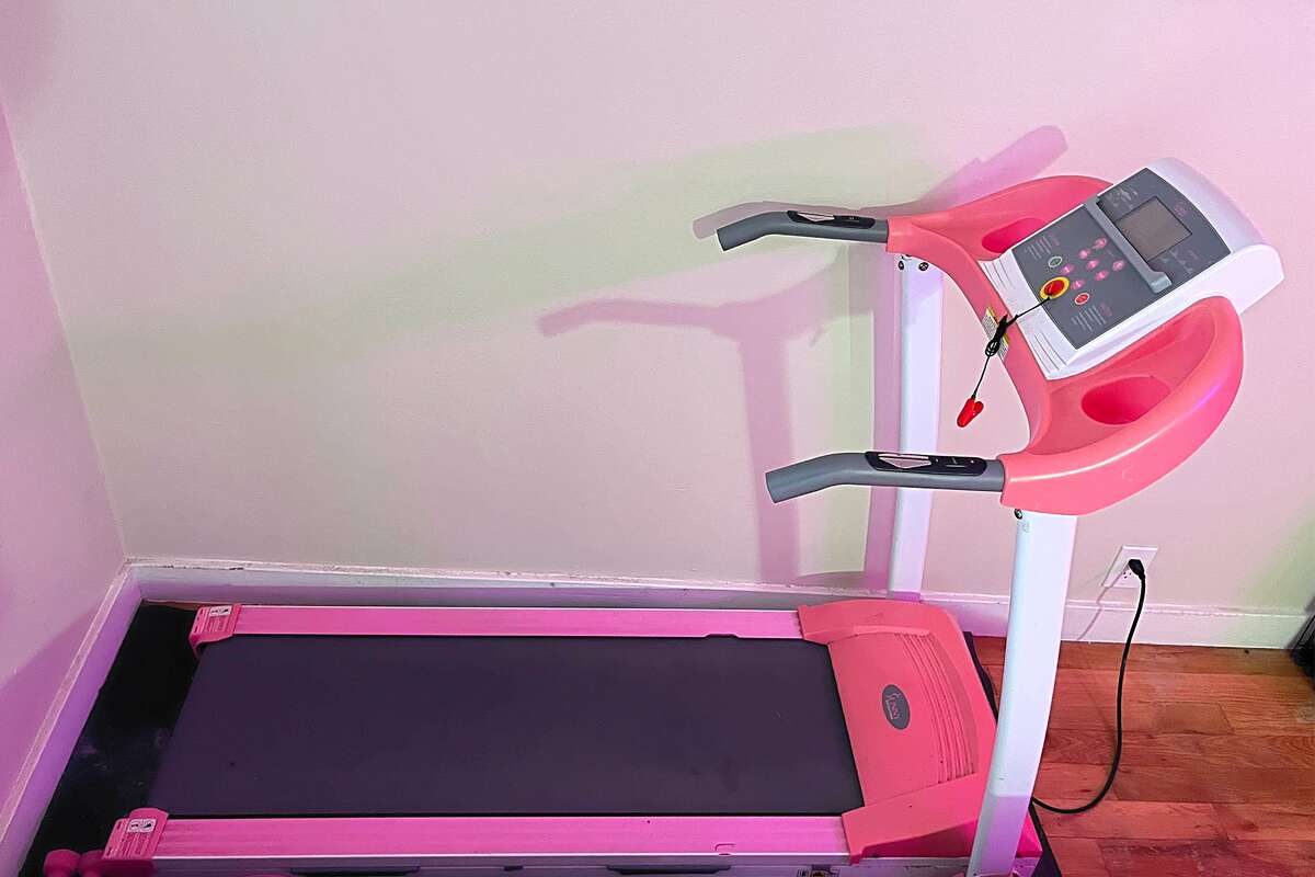 The Sunny Health & Fitness Folding Treadmill assembled and ready to use. 