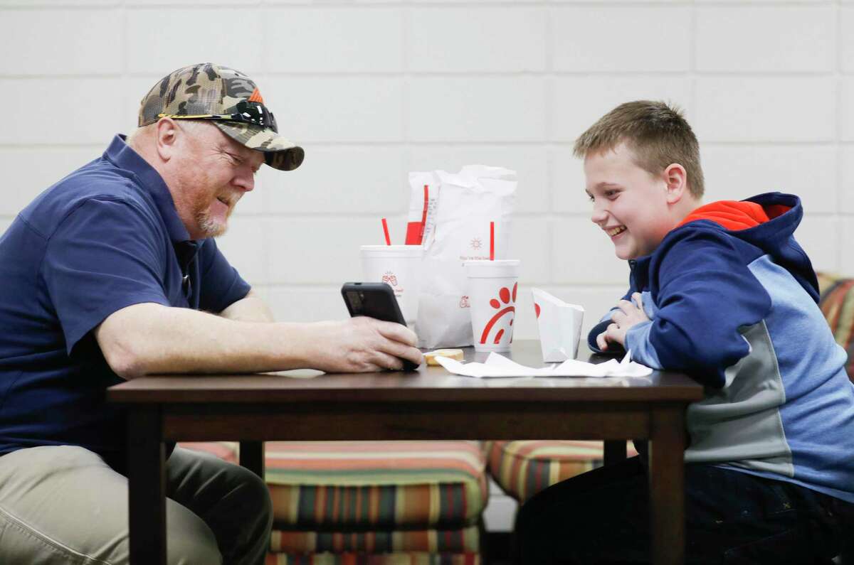 Brayden Reiscia, right, and his mentor Randall Ray talk during lunch as part of Willis ISD’s RISE mentorship program at Lynn Lucas Middle School, Wednesday, Jan. 19, 2022, in Willis. The program, which stands for Relationship Inspiring Students Education, began eight years ago at the middle school and has since grown to be a program at Robert B. Brabham Middle School and Willis High School