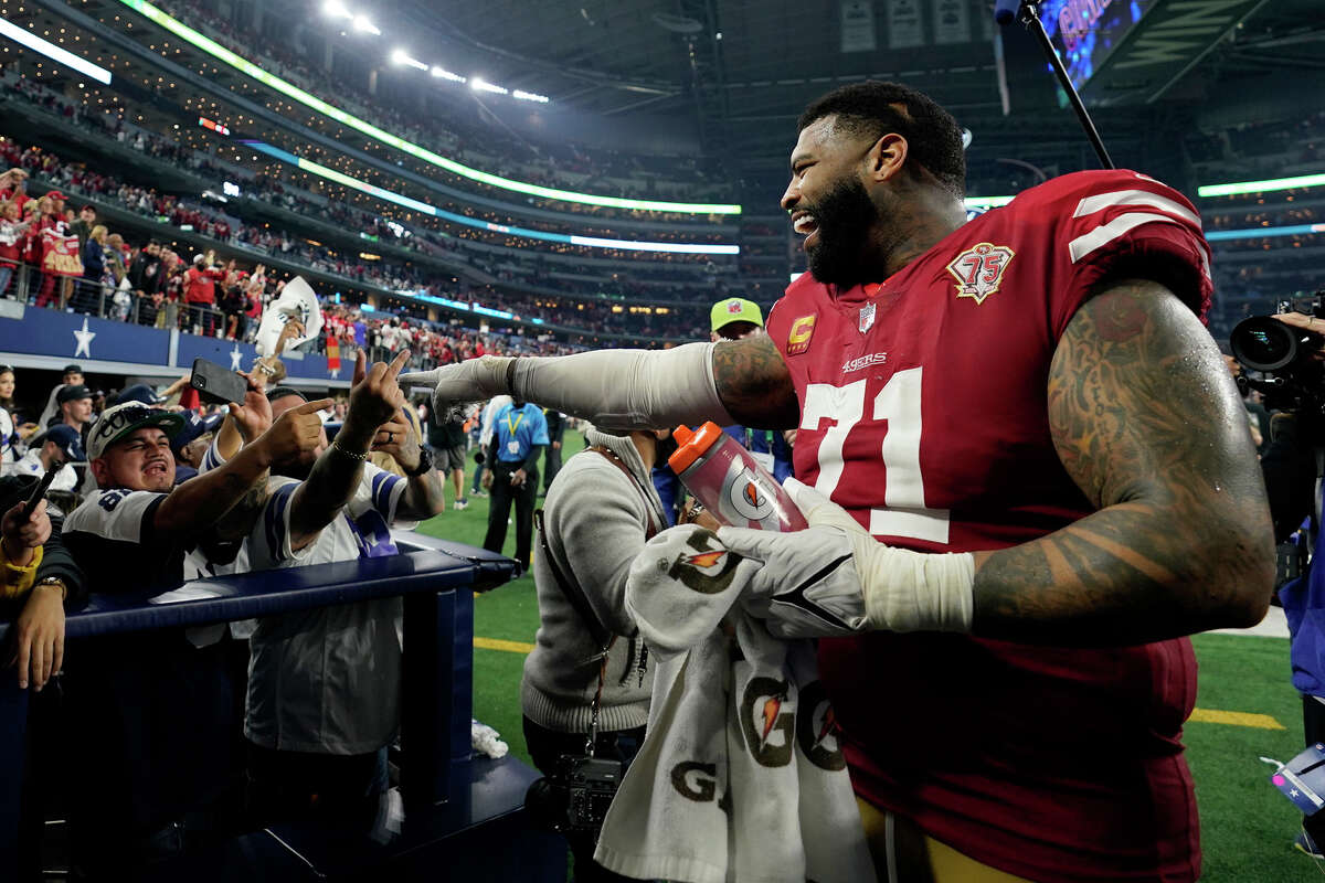 San Francisco 49ers offensive tackle Trent Williams (71) celebrates against the Dallas Cowboys after an NFL wild-card playoff football game, Sunday, Jan. 16, 2022, in Arlington, Texas. The 49ers beat the Cowboys 23-17. (Cooper Neill via AP)