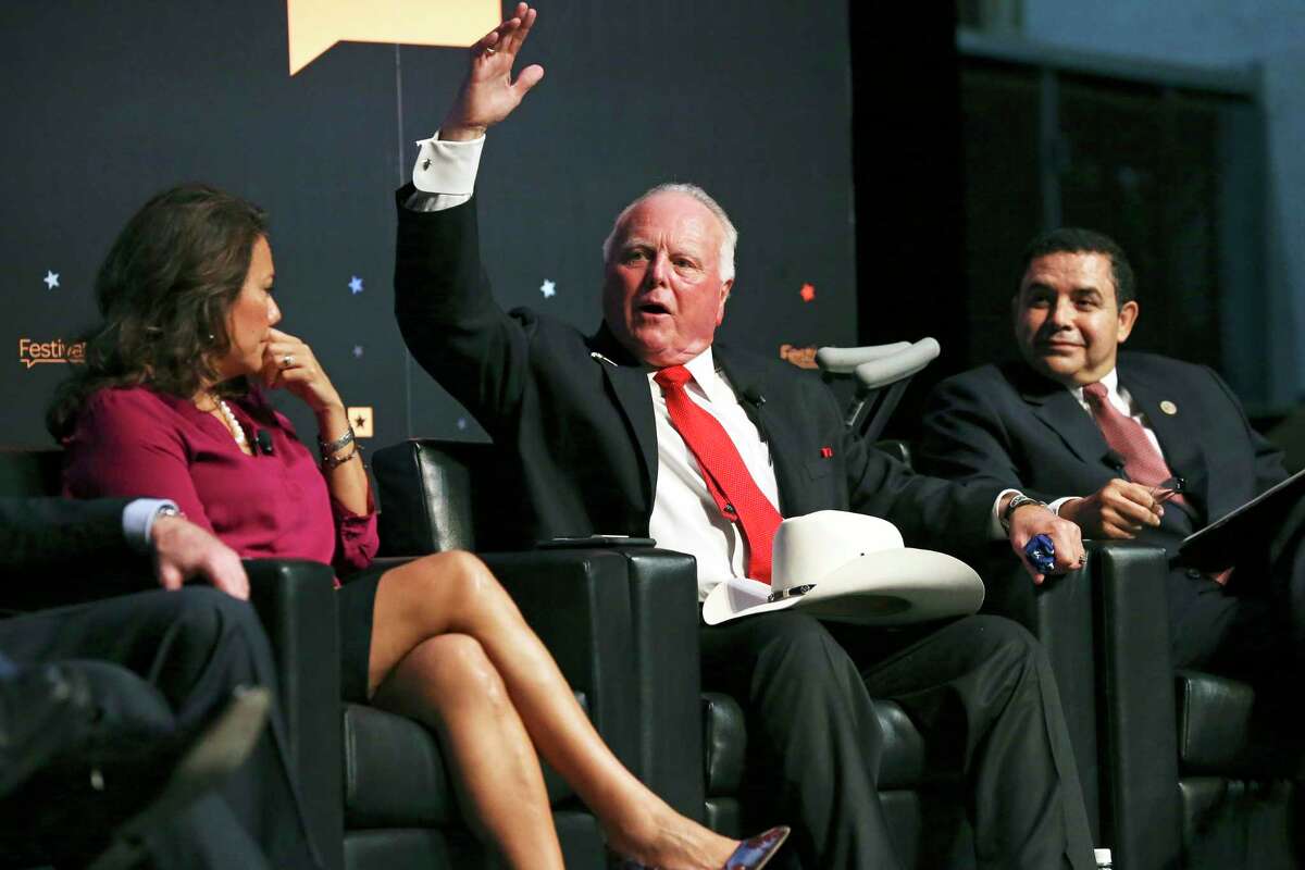 El Paso County Judge Veronica Escobar listens with U.S. Representative Henry Cuellar as Texas Agriculture Commissioner Sid Miller comments in a panel discussion of border issues on the campus of UT at Hogg Auditorium in Austin on September 23, 2017.