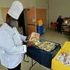 The Chartwells Executive Chef for Norwalk Public Schools, Brett Harding, readies lunches for meal distribution at the Brien McMahon High School site Tuesday, January 19, 2021, in Norwalk, Conn.