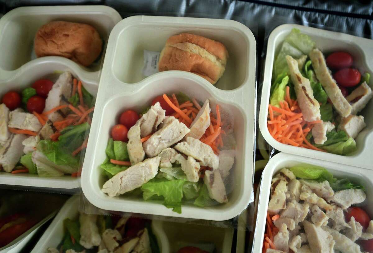 Grille chicken salad lunches for pick-up at the Norwalk Public Schools meal distribution site at Brien McMahon High School Tuesday, January 19, 2021, in Norwalk, Conn.