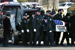 Police pallbearers carry the casket of New Haven police Officer Diane Gonzalez at Evergreen Cemetery in New Haven  Jan. 19, 2022.