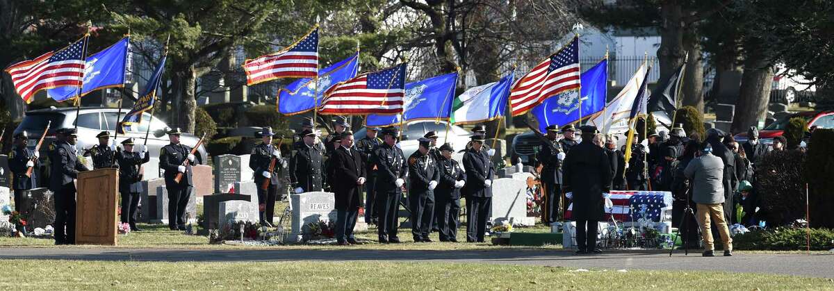Former New Haven Police Chief Anthony Campbell, far left, speaks at the funeral of New Haven police Officer Diane Gonzalez at Evergreen Cemetery in New Haven on Jan. 19, 2022.