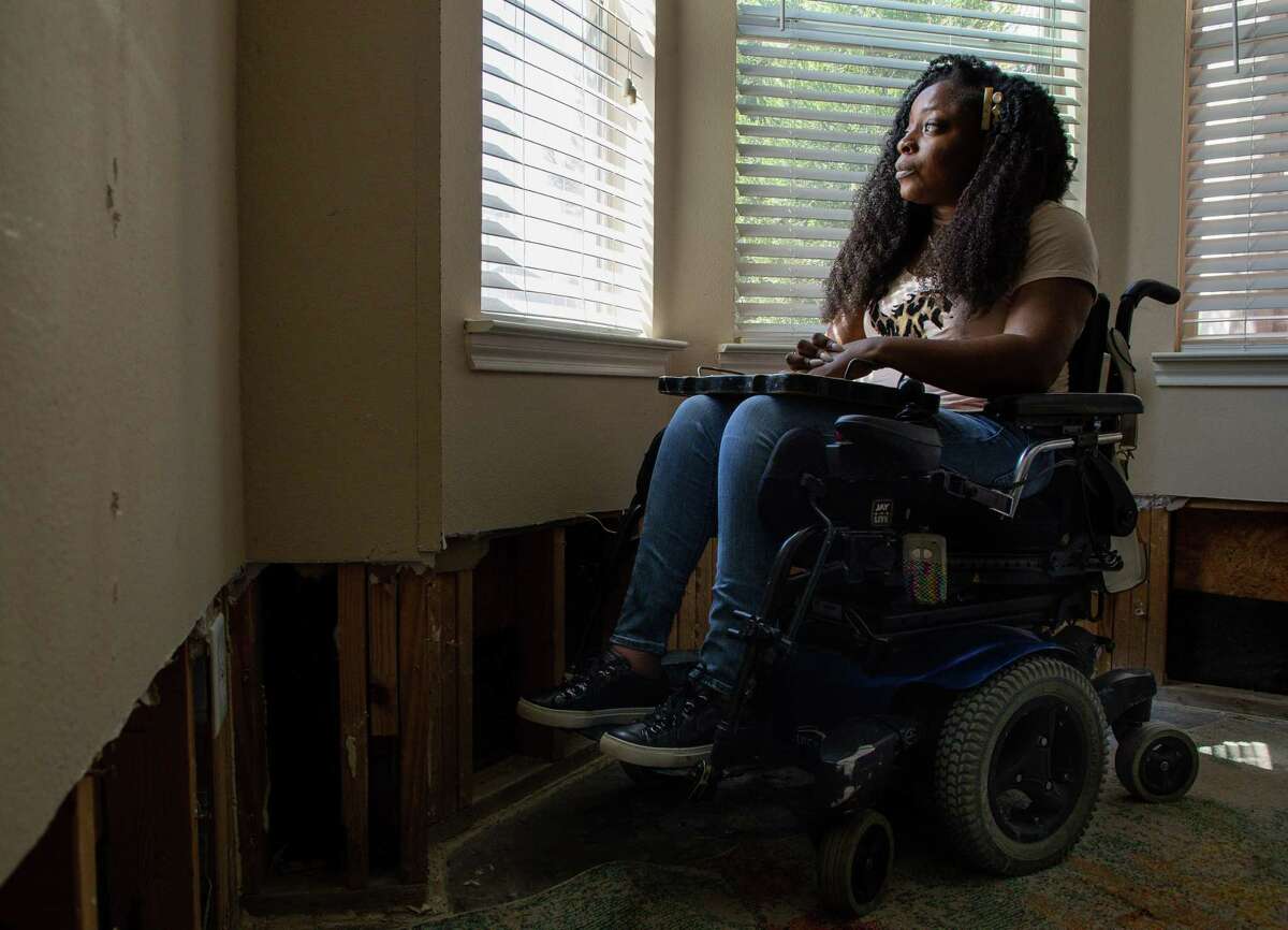 Kemi Yemi-Ese poses for a photograph inside her apartment Thursday, April 1, 2021, in Austin, Texas. Yemi-Ese is paralyzed and had a tough experience in the winter storm. The storm revealed serious problems in how Texas takes care of medically fragile residents.