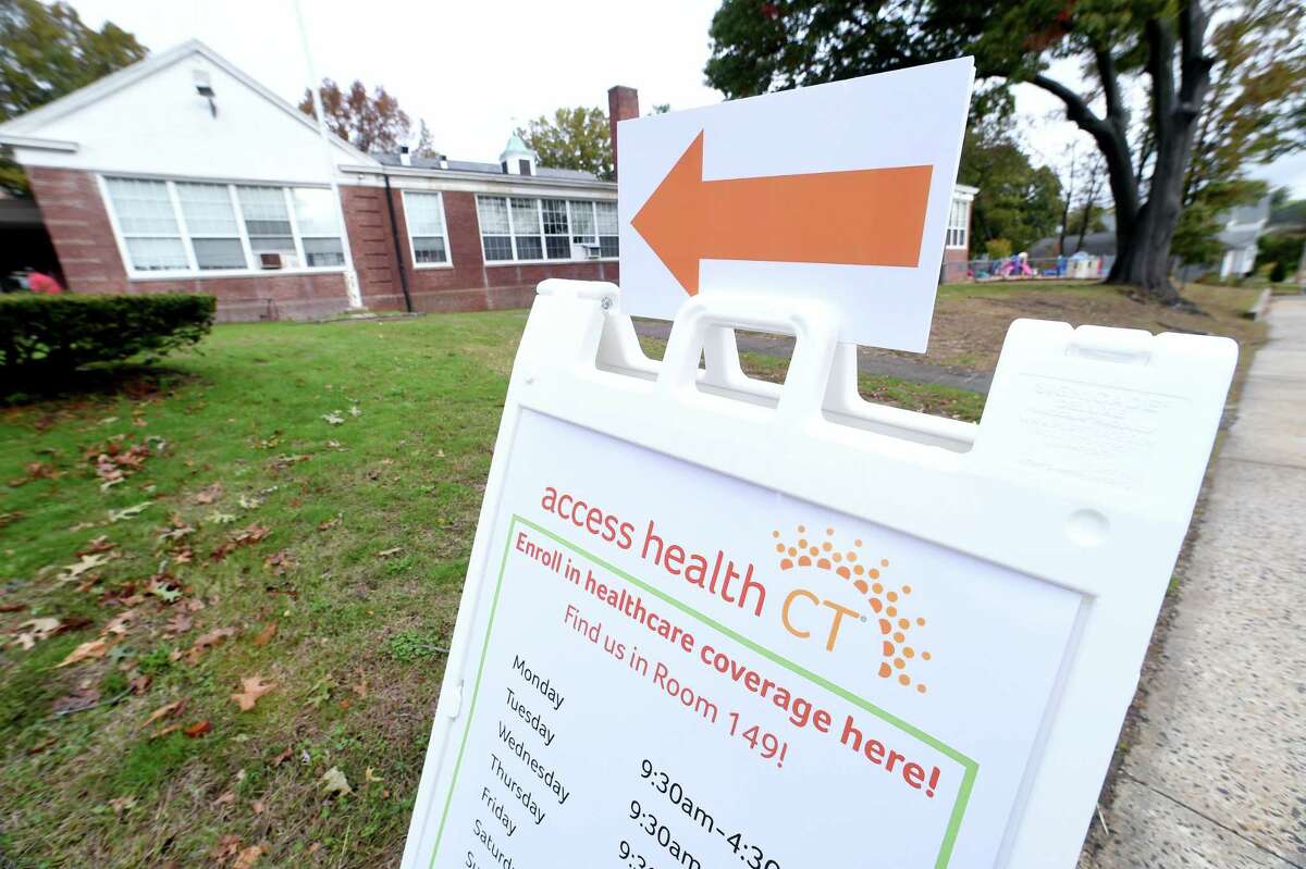 A sign points customers to the Access Health CT office in the Margaret Egan Center in Milford on November 2, 2017.