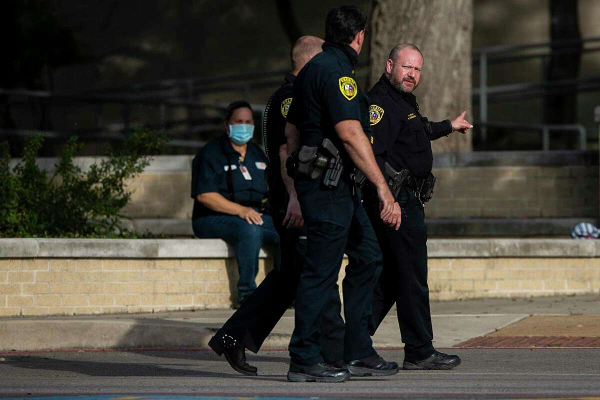 Bexar County Sheriff officers make their way into Alamo Heights High School in Alamo Heights, Texas, on Jan. 19, 2022. A bomb threat was received at the high school and was evacuated around 2:30 p.m. and students released early.