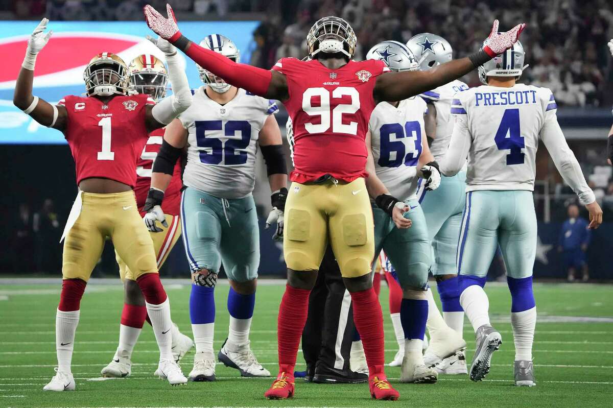 San Francisco 49ers defensive end Charles Omenihu celebrates after his sack of Dallas Cowboys quarterback Dak Prescott.