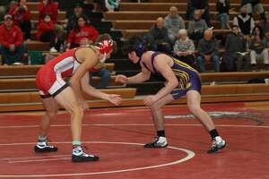 Landen Pangborn (left) and Jared Coxe (right) face off against one another on Wednesday night. 