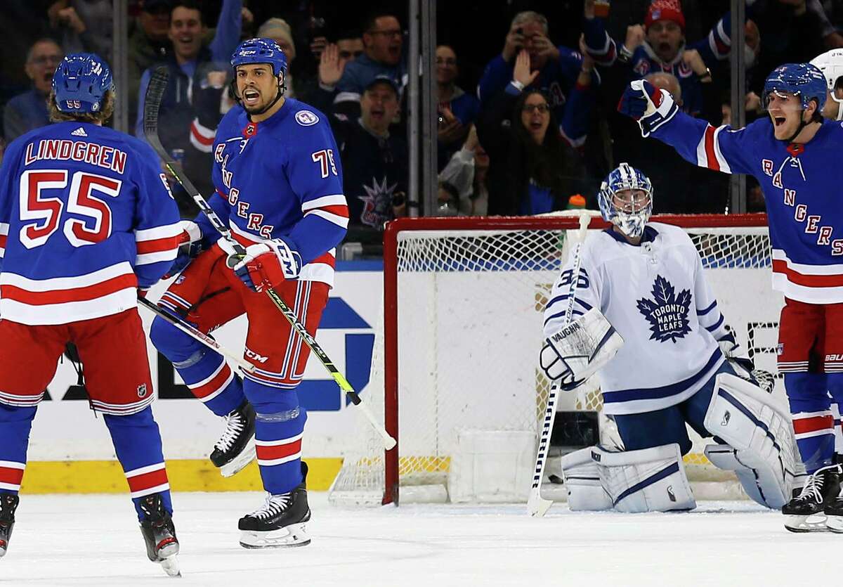 The Rangers’ Ryan Reaves celebrates with teammate Ryan Lindgren (55) after beating Maple Leafs goalie Jack Campbell with a first-period shot. Reaves added a second-period goal.