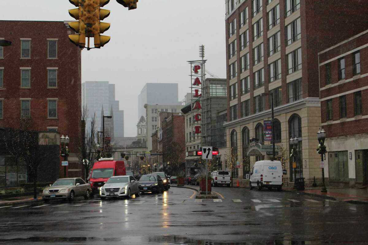 Cars drive down Atlantic Street in Downtown Stamford on Jan. 20, 2022.