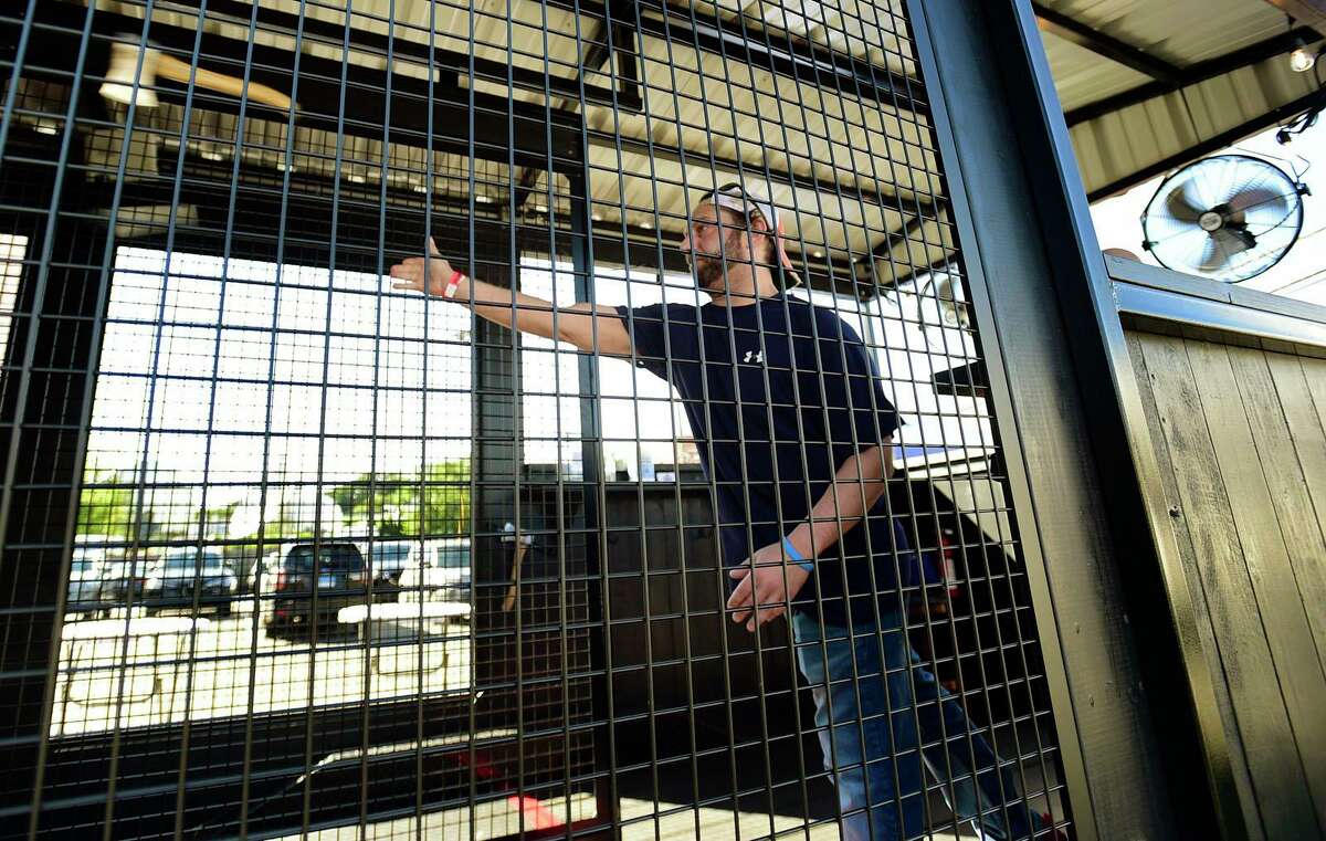 Rich Berberian throws an axe at Big Dog's Mobile Axe Throwing as patrons celebrate Locktoberfest at Lock City Brewing Co. Saturday, September 25, 2021, in Stamford, Conn.